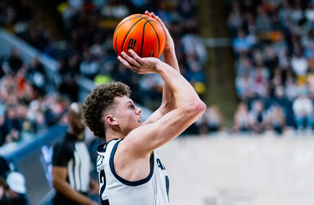 Men's basketball player dunking