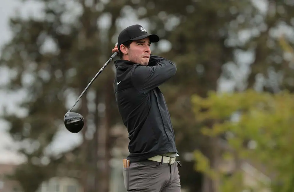 Men's golfer swinging the club