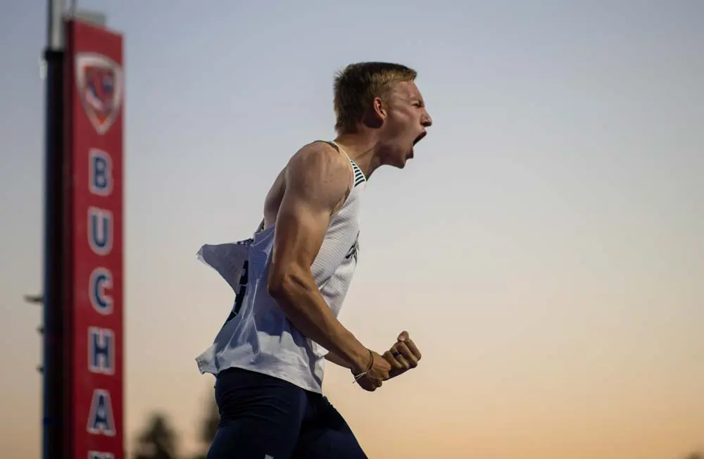 Men's track athlete jumping